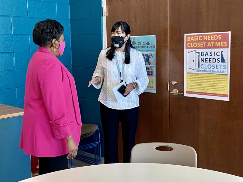 MES social worker Gloria Ho, right, tells NEA President Becky Pringle about the school’s Basic Needs Closet sponsored by the Lt. Governor’s office to provide book bags, school supplies, winter coats, hats, gloves and more for students.